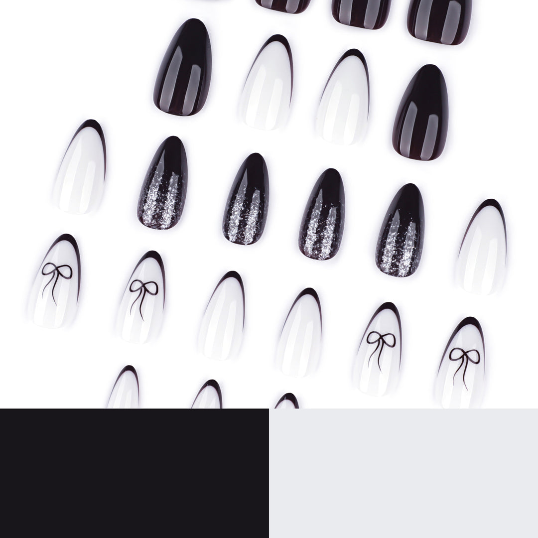 Artful nail art with elegant bow pattern and glitter accents Kalsten
