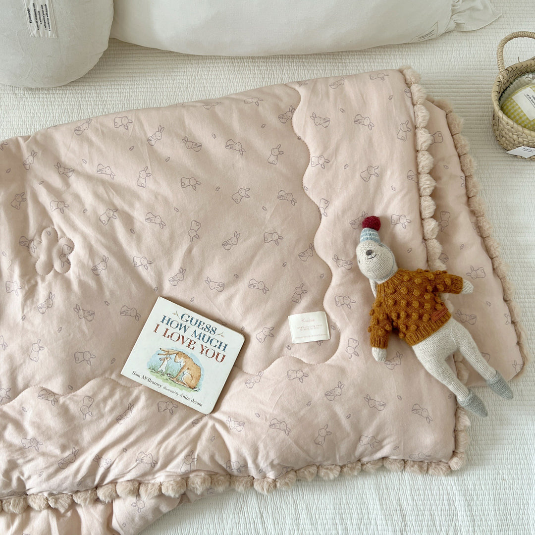 Cuddle blanket baby quilt with plush lining and bunny motif