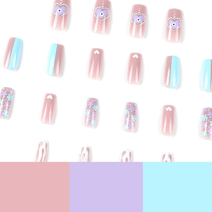 Artful nail art with floral accents and glitter embellishments Kalsten