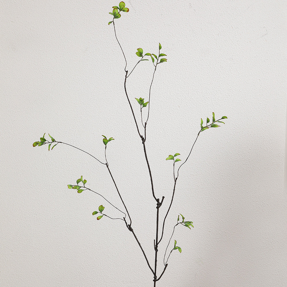 Artificial flower branch with vibrant orange flowers