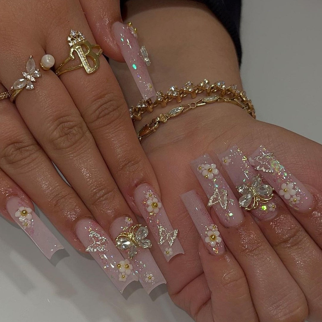 Artificial Nail Art Set with playful flower design and glittering accents Kalsten