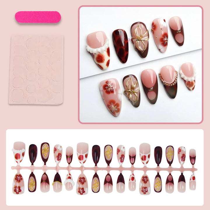 Artificial nail set with luxurious floral designs and glitter accents Kalsten