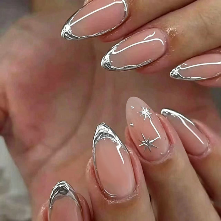 Shiny stiletto nails with elegant silver embellishment Kalsten
