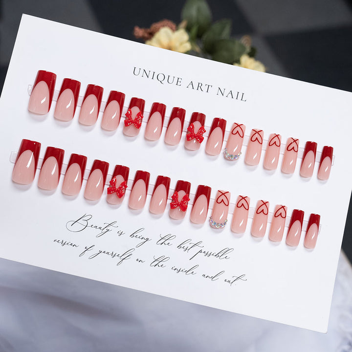 Artistic Press-On Nail Set with Heart and Bow Designs