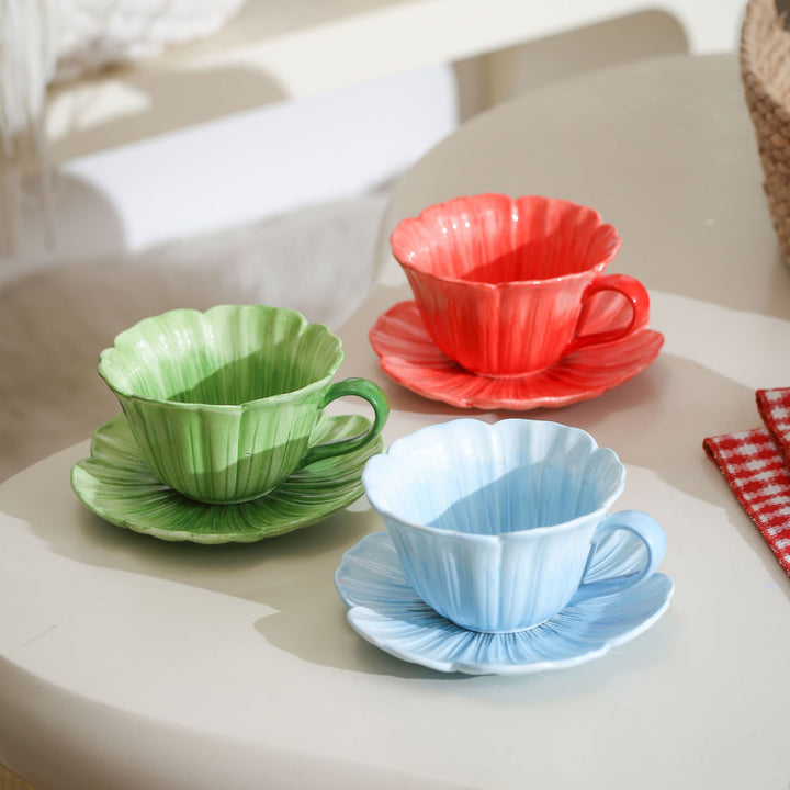 Ceramic mug with saucer in flower shape