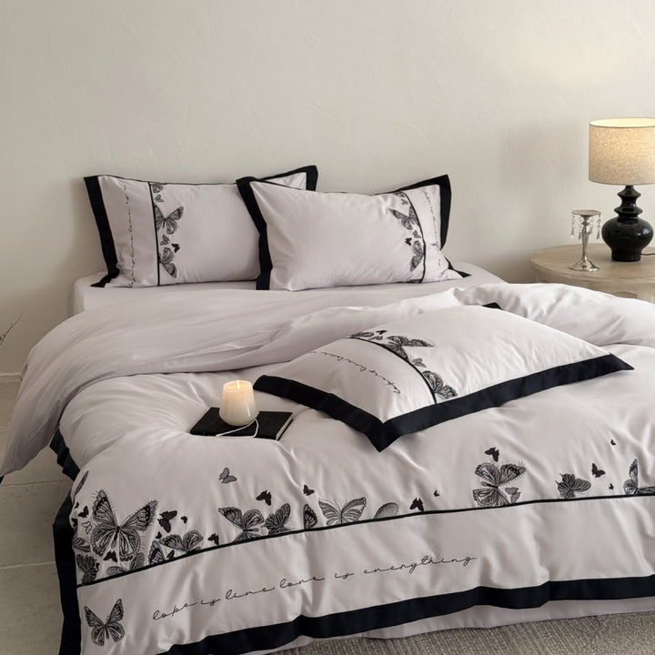Bedding set with butterfly embroidery and contrast piping