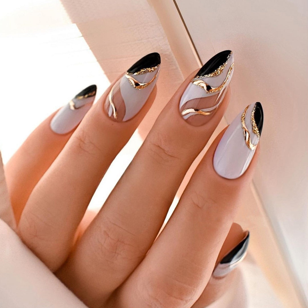 Artificial nail creation with glamorous tips and glitter details Kalsten