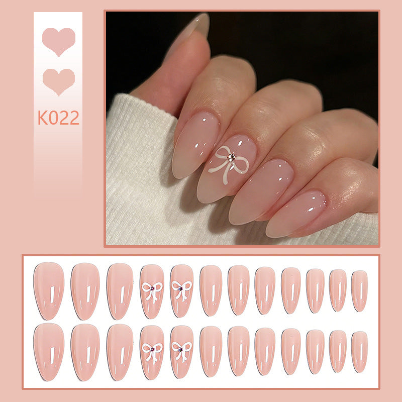 Acrylic nail set with elegant bow accents Kalsten