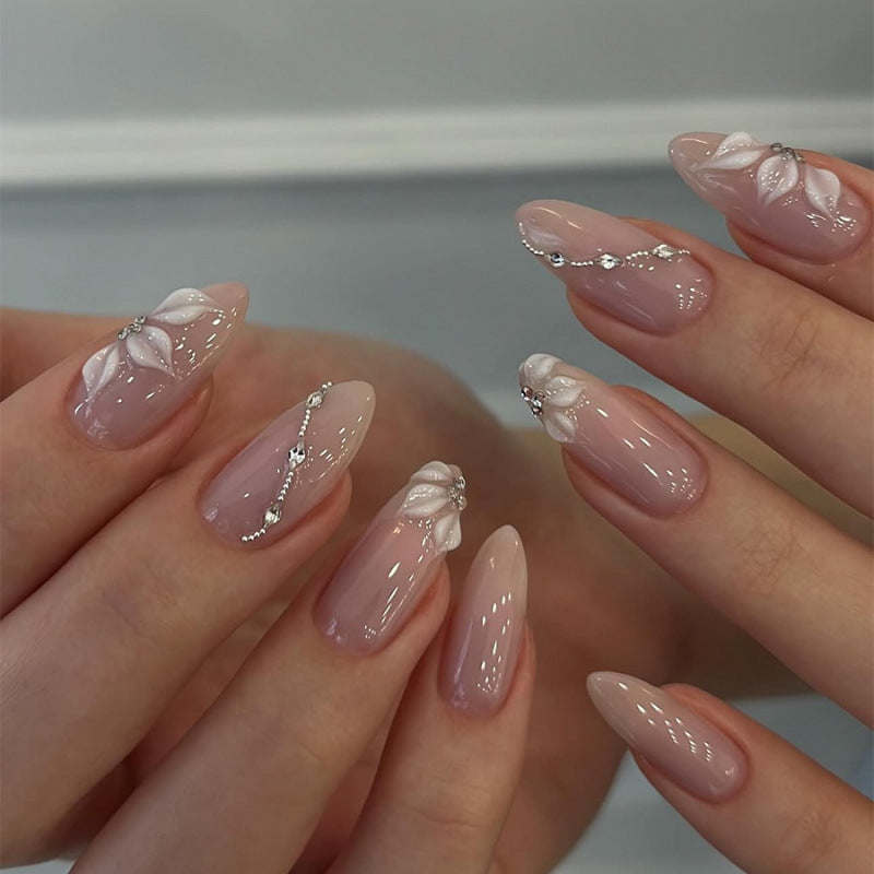 Artificial nail set with elegant flower designs and shimmering accents Kalsten