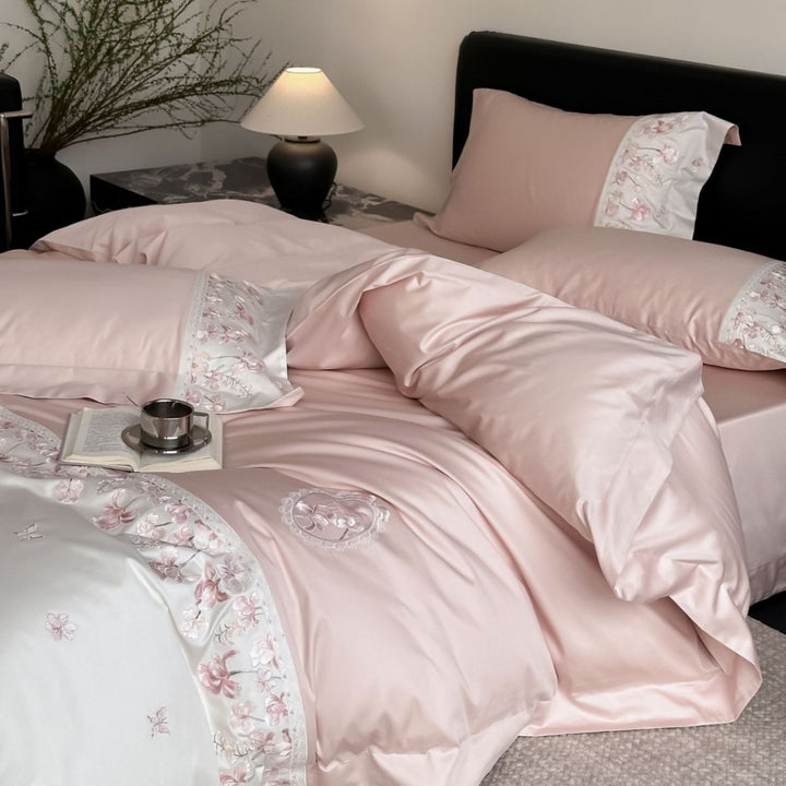 Luxurious satin bedding set with floral stitched border