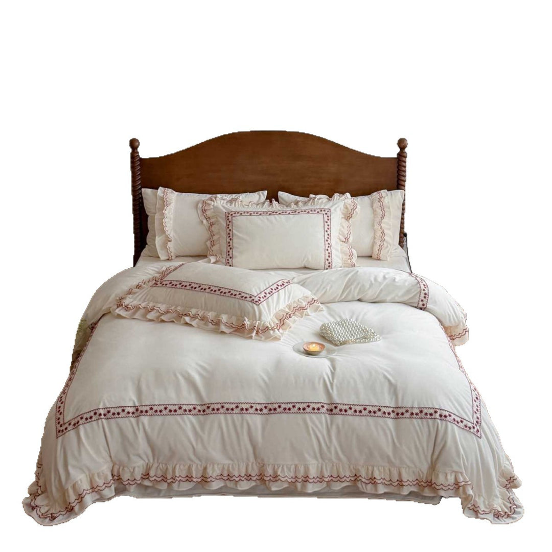 Romantic bedding set with ruffles and embroidered border