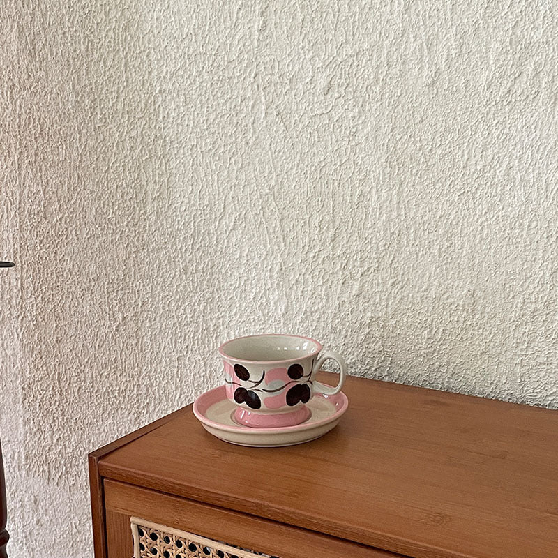 Ceramic coffee cup set with saucer and hand-painted leaf ornament