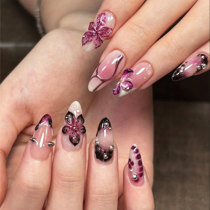 Acrylic nail set with elegant floral design and glossy accents Kalsten