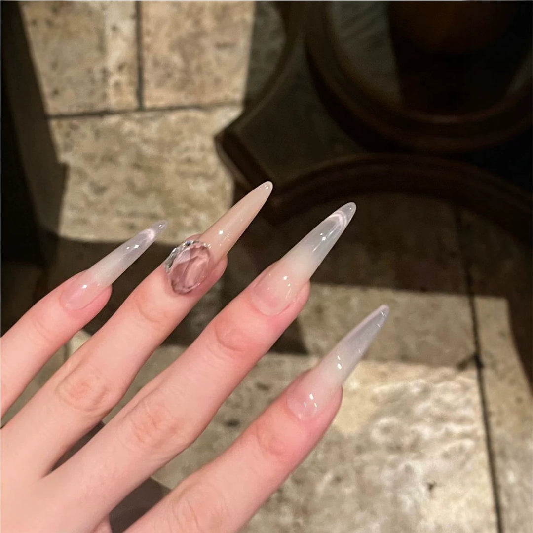 Glamorous Stiletto Nail Art Extensions with Decorative Accents