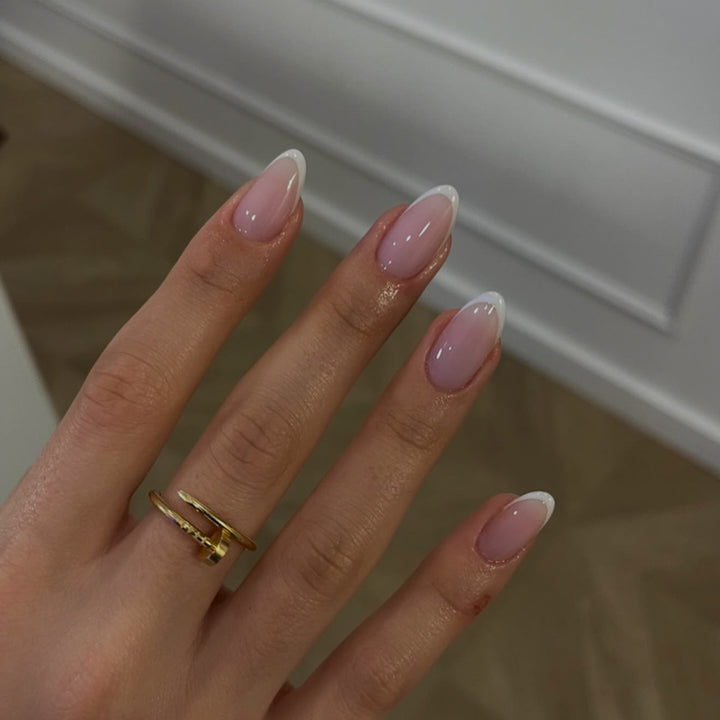 Artful Nail Art with Flower Design and Blue French Tip Kalsten