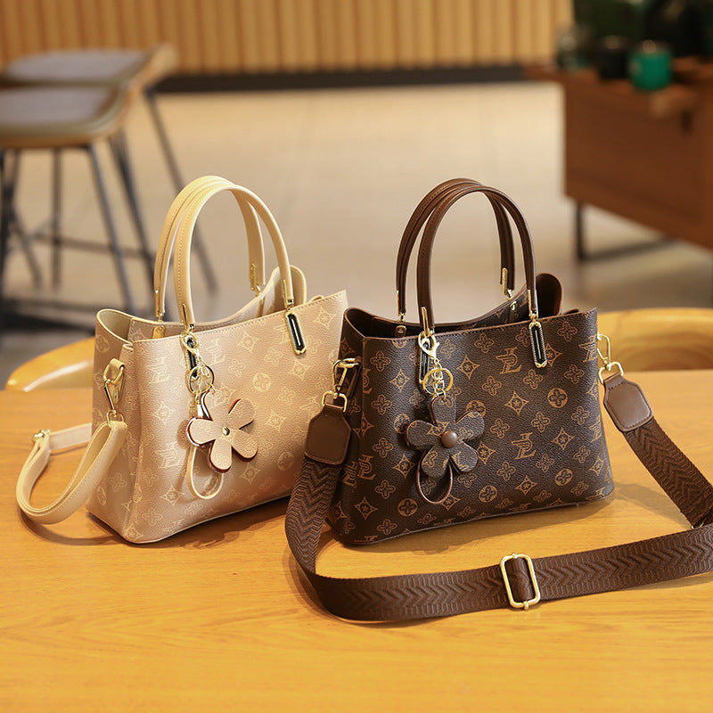 Elegant Handheld Tote Bag with Charming Floral Keychain