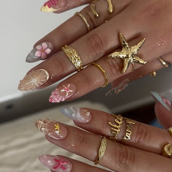 Artificial nail set with floral designs and elegant accents Kalsten