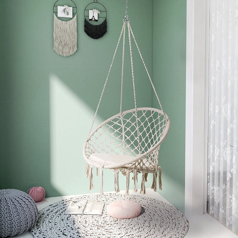 Boho macrame hanging swing chair with faux fur cushion and fringe Kalsten