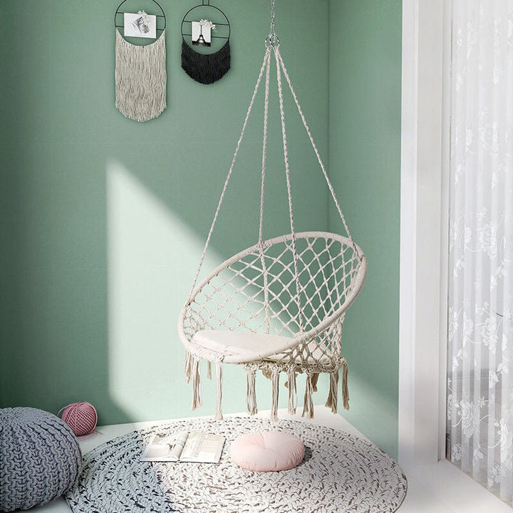 Boho macrame hanging swing chair with faux fur cushion and fringe Kalsten