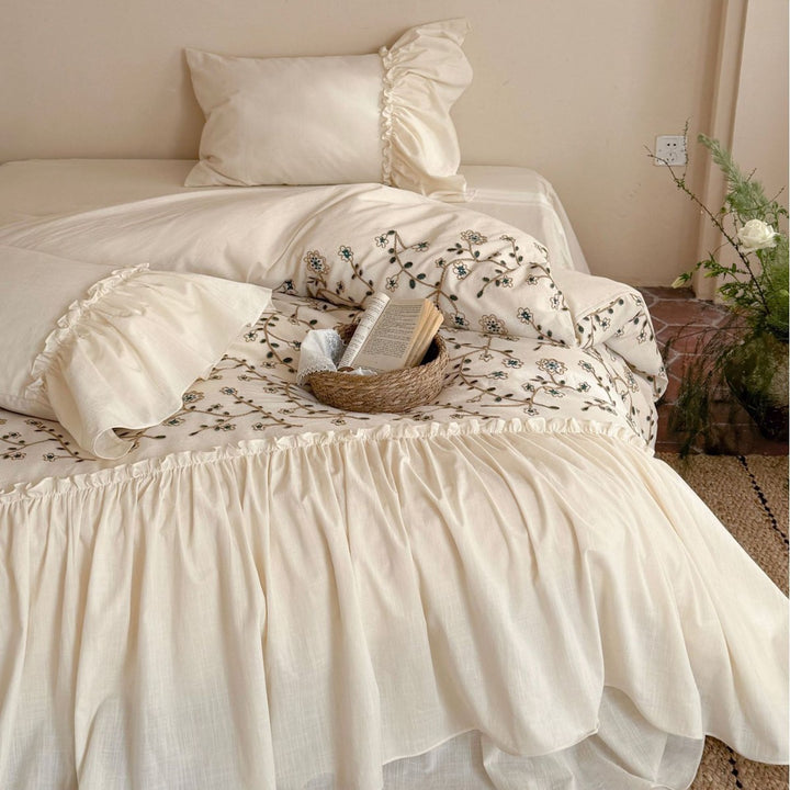 Bedding set with floral embroidered cover, gathered ruffle and cotton texture