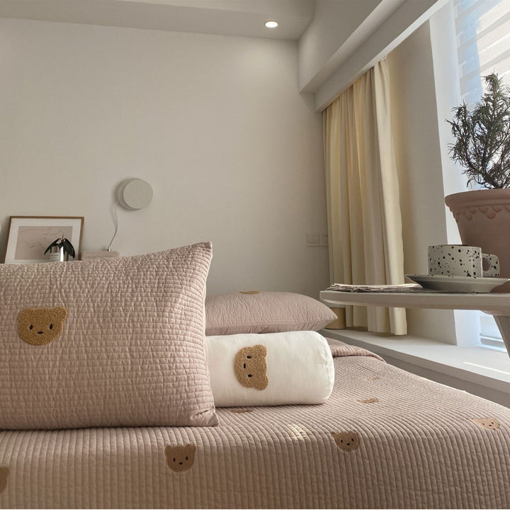 Padded quilt set with embroidered bear appliqués and neck roll
