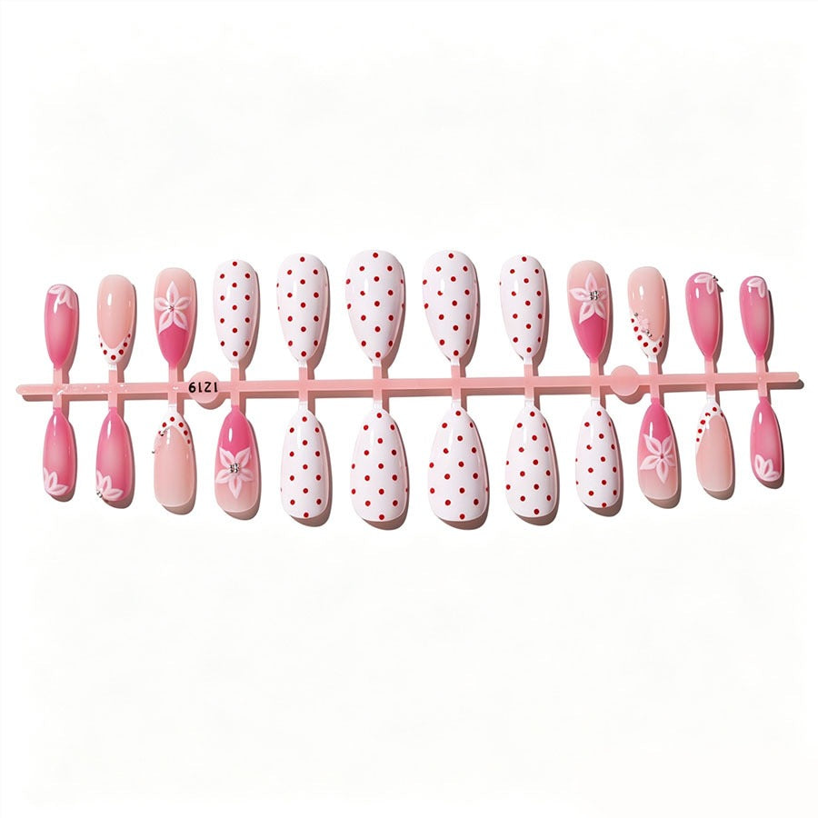 Artificial nail set with floral accents and charming polka dots Kalsten