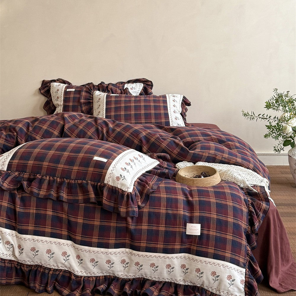 Checked bedding set in vintage cottage style with ruffle and embroidered border