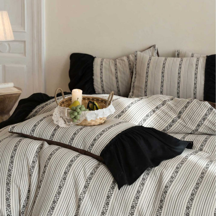 Ruffled duvet cover set with striped jacquard trim and reversible pillow