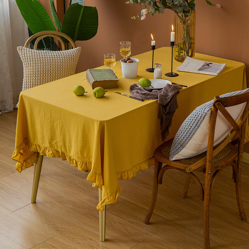 Rectangular tablecloth made of cotton waffle fabric with fine ruffle trim