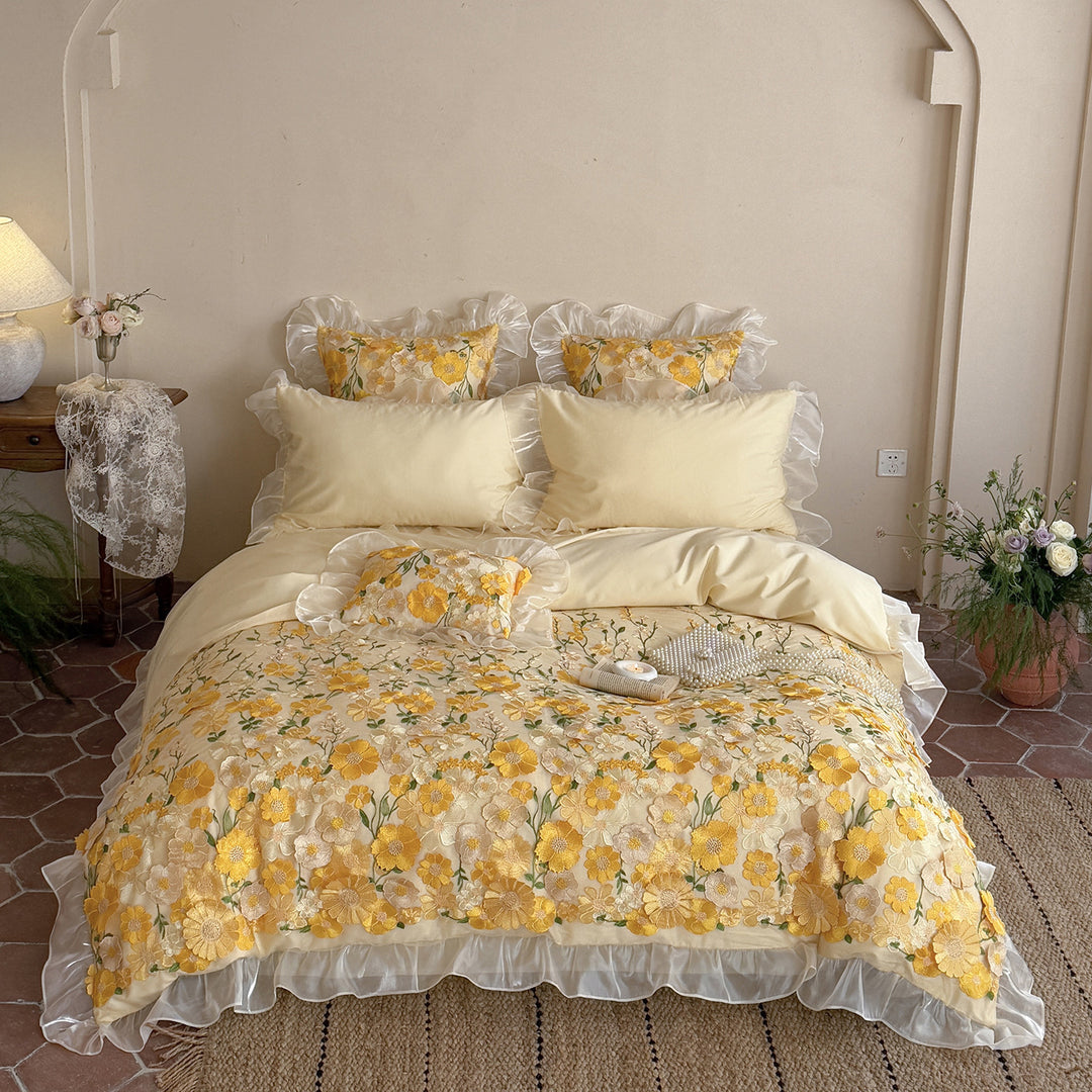 Embroidered bedding set with 3D flower application and ruffle hem