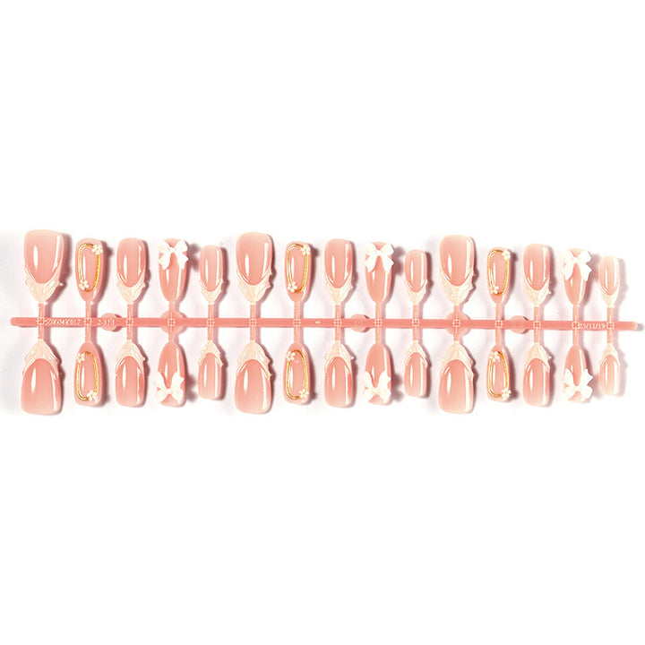 Artificial nail set with playful bow accents and delicate embellishments Kalsten