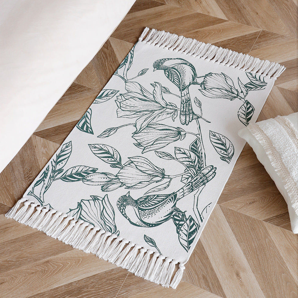 Woven table runner with botanical bird print and decorative fringes