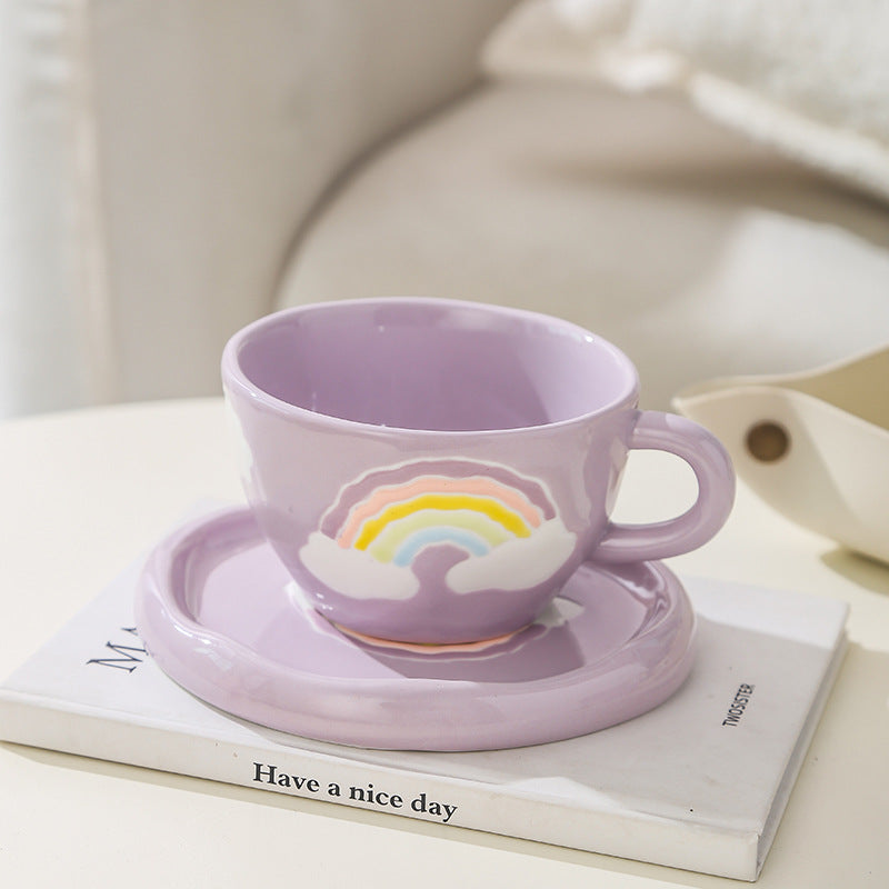 Stoneware breakfast mug with saucer and embossed rainbow design