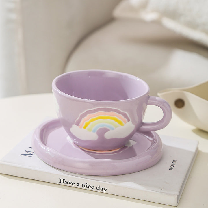 Stoneware breakfast mug with saucer and embossed rainbow design