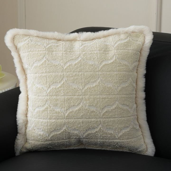 Square decorative pillow with embossed circular relief and soft faux fur edging