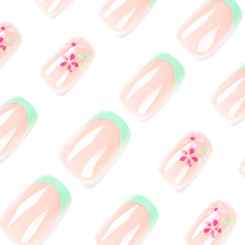 Artificial nails with floral accents and neon tips Kalsten