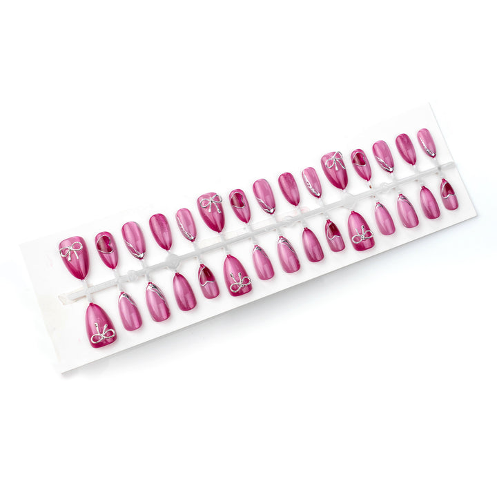 Acrylic nail set with elegant heart and bow decorations Kalsten