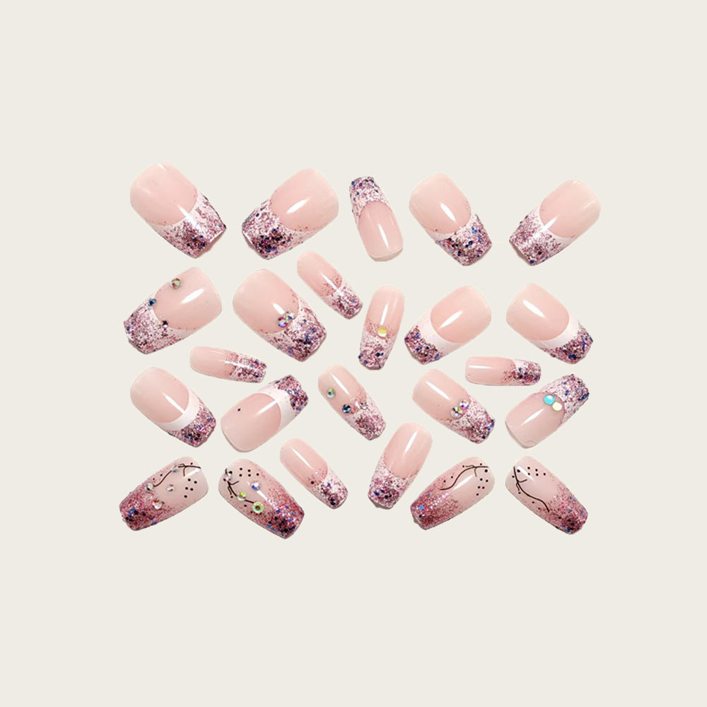 Glamorous artificial nails with glitter and rhinestone embellishments Kalsten