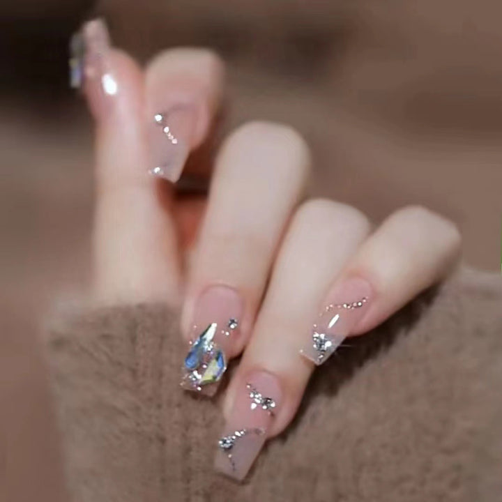 Glamorous artificial nails with glitter accents Kalsten