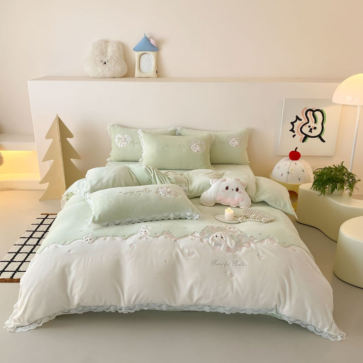 Romantic children's bedding set with embroidered bunny appliqués and lace ruffle