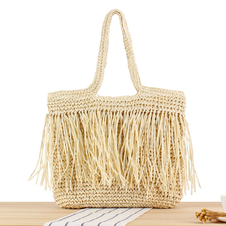 Designer straw bag with fringe decoration Kalsten