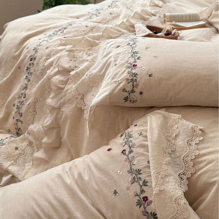Romantic bedding set made of linen look with floral embroidery, lace trim and frill