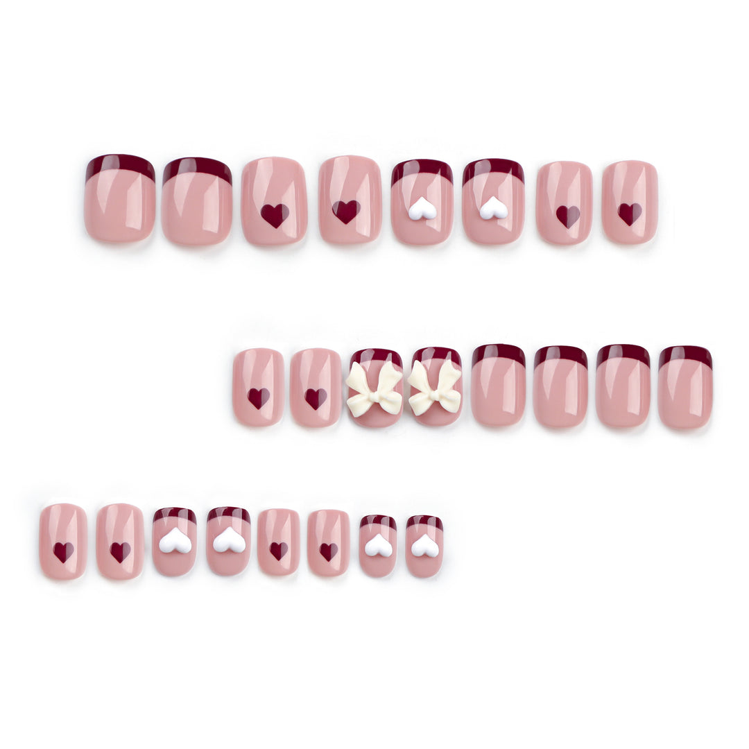 Artful nail art with heart and bow motifs Kalsten