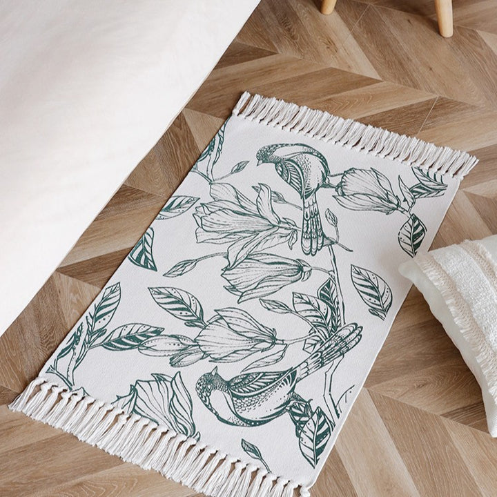 Woven table runner with botanical bird print and decorative fringes