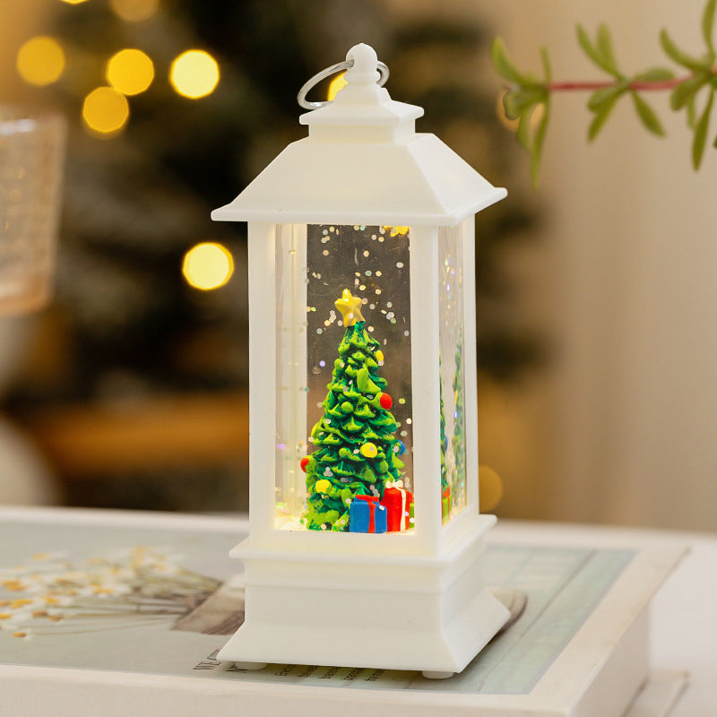 Christmas lantern with LED lighting and decorative snow effect