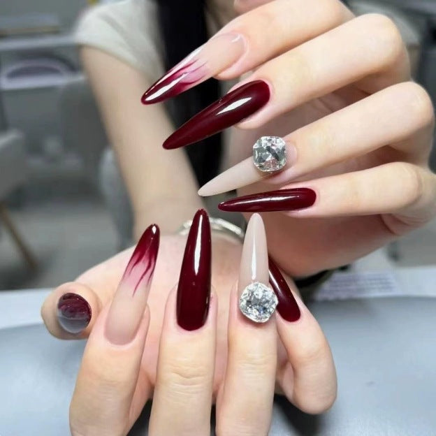 Elegant Stiletto Nail Enhancements with Gem Accents Kalsten