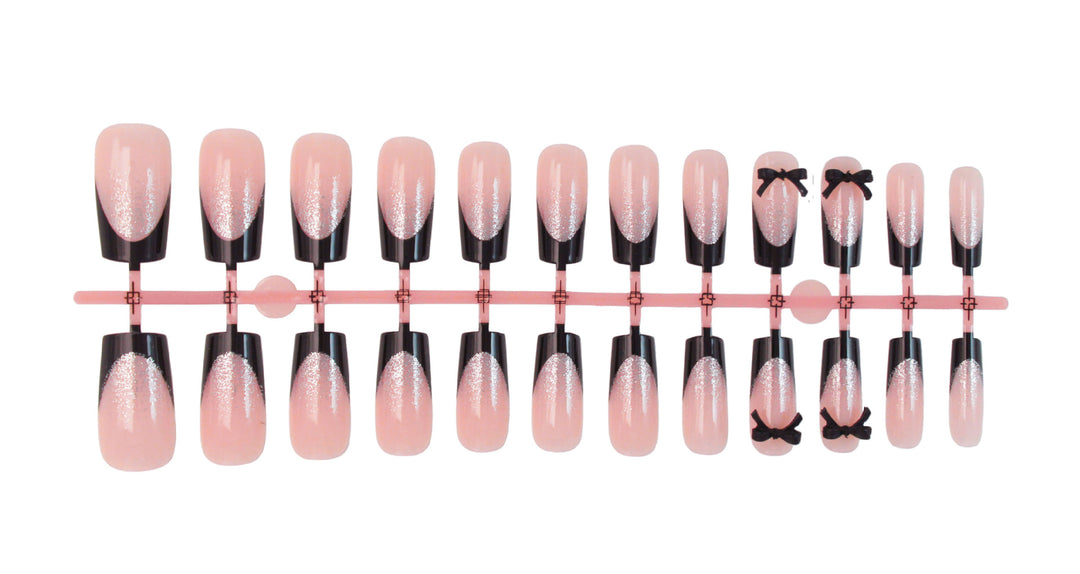 Artificial nail set with elegant glitter accents and bow details Kalsten