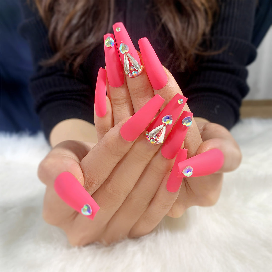 Artful nail art with glitter and heart accents Kalsten