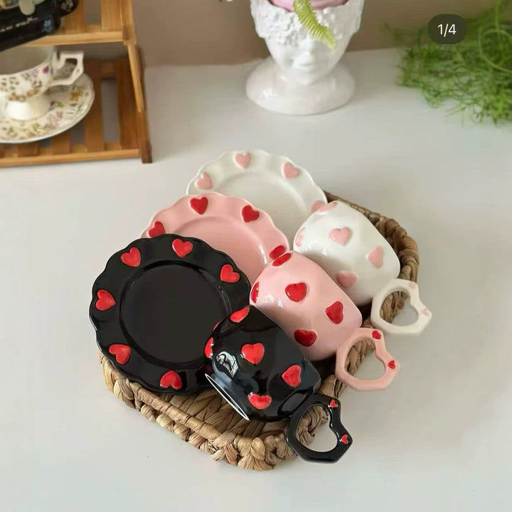 Porcelain cup set with heart-shaped handle and embossed decorative hearts