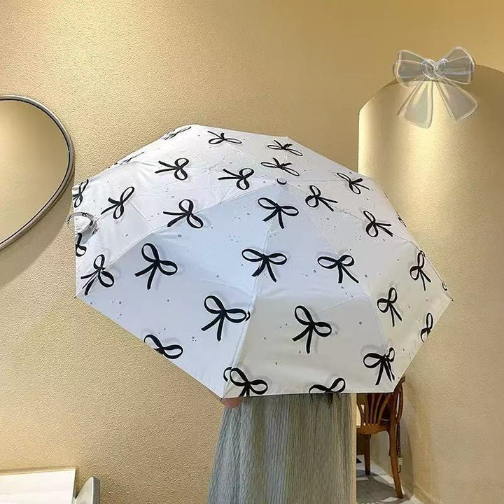 Women's foldable umbrella with elegant bow design Kalsten
